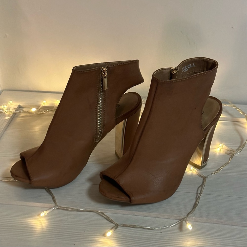 BAMBOO high heeled light brown boots with gold accents.